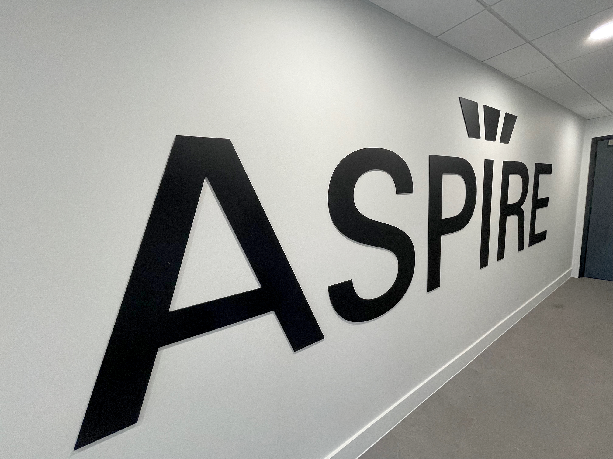 Schüco UK Aspire wall lettering installation in Milton Keynes office featuring precision cut 3D corporate signage